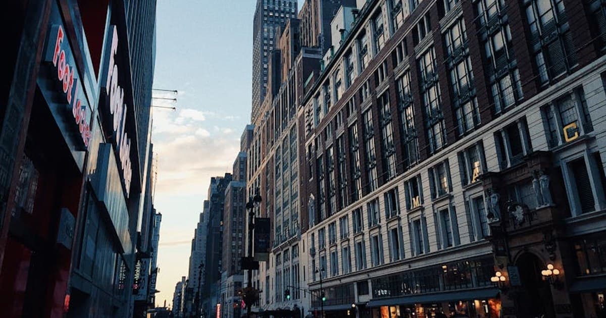Explore the vibrant urban life of New York City with towering skyscrapers and bustling street activity.